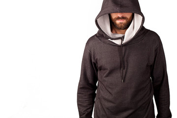 Model tests of a man with a beard. A guy in a tracksuit. Face covered with a hood