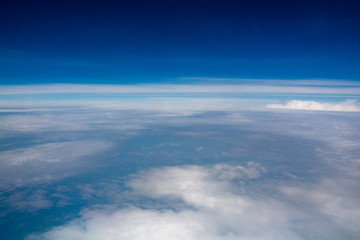 Fototapeta na wymiar Blue sky with clouds from an airplane