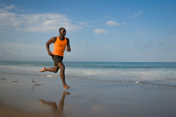 athletic full body portrait of young attractive and fit black African American man running on the...