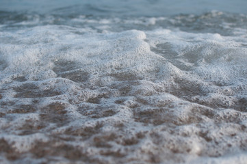 Obraz na płótnie Canvas White foam from a sea wave, can be used as a backgroundf