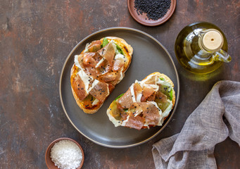 Bruschetta with prosciutto . Italian cuisine. National food.
