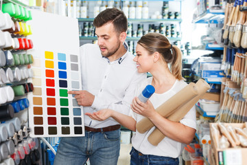 Couple using palette scheme in store