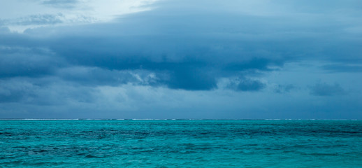 Horizontal view of dramatic overcast sky and sea.