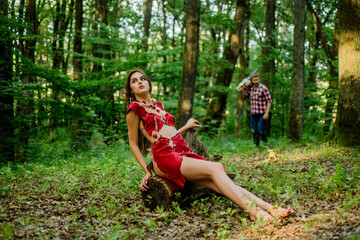Wild attractive woman in forest. Folklore character. Living wild life untouched nature. Sexy girl. Wild human. Female spirit mythology. Forest fairy. Fashion and culture. Wilderness of virgin woods