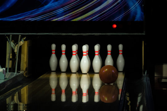 Ball Rolling On The Right Side A Bowling Alley Lane With Pins