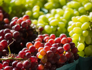 Red and Green grapes at produce stand