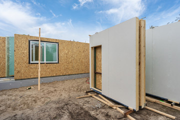 Obraz na płótnie Canvas Construction of new and modern modular house