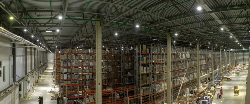 Warehouse interior with shelves, pallets , boxes and equipment
