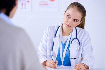 Doctor and patient are discussing something in medical office
