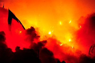 Fans of serbian soccer team FC Red Star lit torches ofter team scored a goal