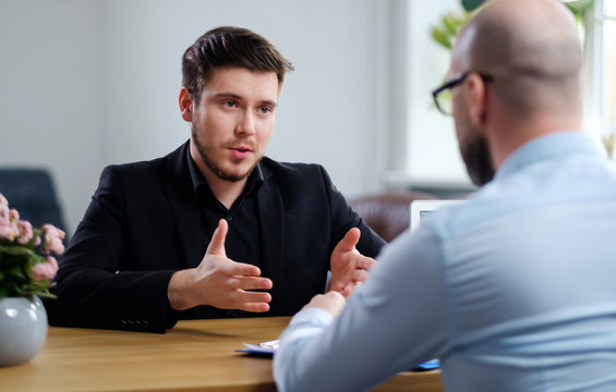 Confident young man attending job interview
