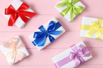 gifts on a colored background top view. Holiday, giving presents, birthday.