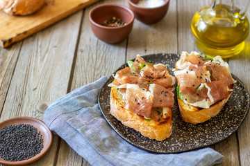 Bruschetta with prosciutto . Italian cuisine. National food.