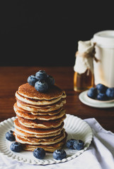 Blueberry Homemade pancake with sweet honey on wood table.Vertical photos