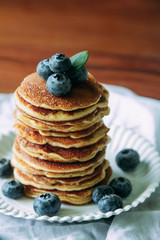Blueberry Homemade pancake with sweet honey on wood table.Vertical photos