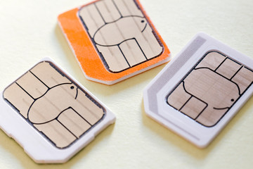 Three mini-sim cards for mobile phones