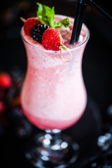 fresh forest fruit lemonade - blueberry, raspberry, blackberry with smashed ice, ginger and honey