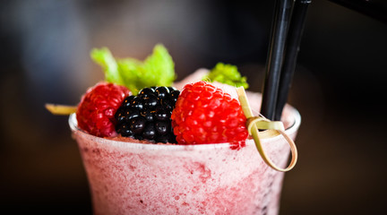 fresh forest fruit lemonade - blueberry, raspberry, blackberry with smashed ice, ginger and honey