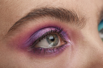 Fototapeta na wymiar eye make up close up shot. colorful festive makeup