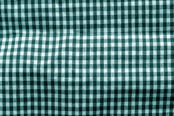 Checked fabric texture in cyan tone.