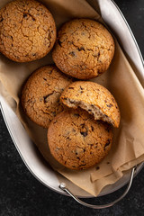 Cookies with chocolate on baking paper. Top view.