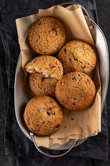 Cookies with chocolate on baking paper. Top view.