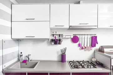 kitchen interior in purple, white and gray colours. Trendy ultraviolet kitchen room design. Modern home interior