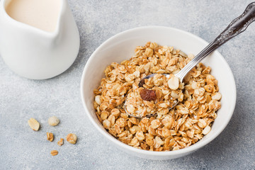 Healthy breakfast. Fresh granola, muesli with yogurt on grey background. Copy space