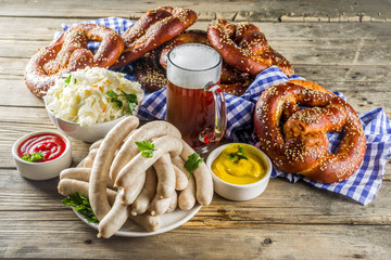 Bavarian German holiday traditions. Oktoberfest food and beer glass mug. Background for congratulations with Oktoberfest, autumn restaurant menu.