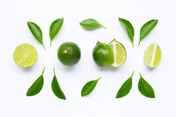 Fresh limes with leaves isolated on white