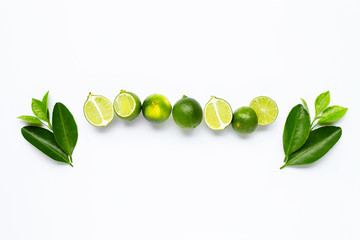 Fresh limes with leaves isolated on white