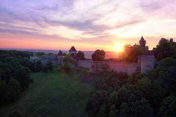 Helfstyn castle (German: Helfenstein, Helfstein), aerial view of a fortifications of gothic castle. Silhouettes of castle walls against vibrant colors of evening sky. Czech landscape, Moravia region.