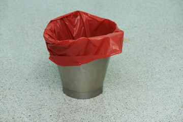 An empty red bin in operative room