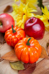 Happy Thanksgiving concept. Closeup of pumpkin, candle light and apple