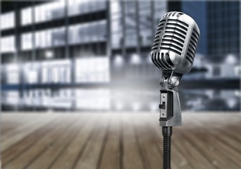 Retro style microphone on  background