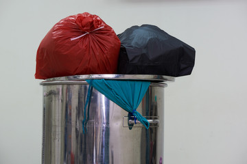 Two tied surgical garbages in plastic bags