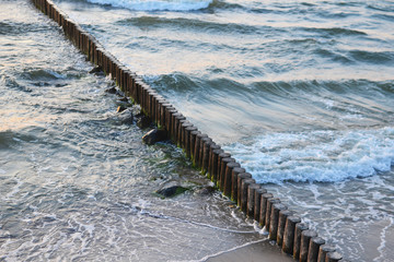 waves beat against a breakwater, top view