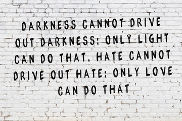 White wall and black inscription of sensible quote on it