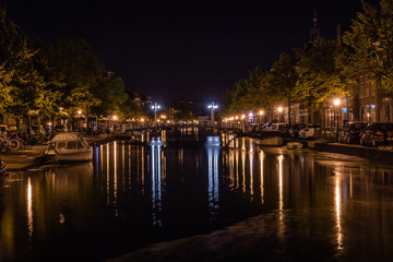 Dutch city center with blurred reflections in water