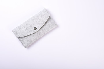 Felting wallet on the white background with copy space 