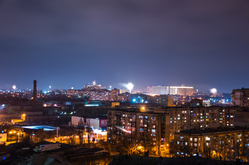 Fototapeta na wymiar Firework on New Year's Eve over the city.