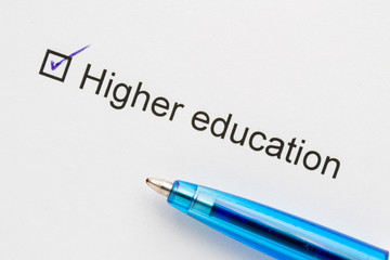 Higher education - check mark with pen on paper.
