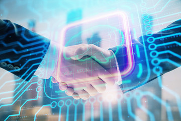 Multi exposure of human brain drawing on city view background with handshake. Concept of brainstorm