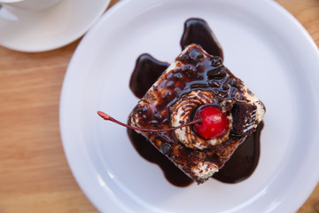 Top view red cherry fruit on chocolate cake
