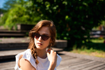 Young woman with sunglasses in the Park