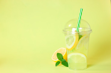 Lemonade or mojito cocktail with lemon and mint