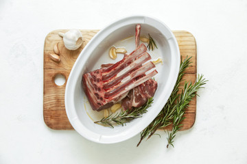 Marinated lamb rack with garlic and rosemary, top down view
