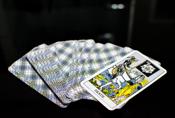 Deck of tarot card with opened card of death