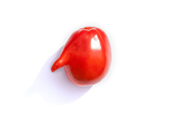 Ugly deformed bright red tomato, grown organic,isolated on white background..