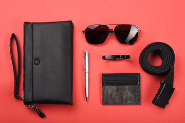 Men's clothing and personal accessories on red background